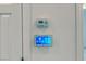 Wall-mounted security system with a touchscreen display and a control panel at 3891 Sedgwick, Pahrump, NV 89061
