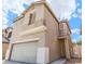 Charming two-story home featuring an attached two-car garage and a neutral color scheme at 4107 Macadamia Dr, Las Vegas, NV 89115