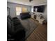 Cozy living room featuring comfortable seating and natural light at 4107 Macadamia Dr, Las Vegas, NV 89115