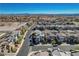 An aerial view showcases the neighborhood layout in its entirety and the scenic mountain views at 513 Founders Creek Ave, North Las Vegas, NV 89084