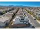 Beautiful aerial view of a residential neighborhood with houses and distant mountains on a bright sunny day at 513 Founders Creek Ave, North Las Vegas, NV 89084