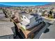 An aerial shot capturing the property's location within a well-maintained neighborhood with mountain views at 513 Founders Creek Ave, North Las Vegas, NV 89084