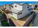A beautifully designed backyard featuring gravel landscaping, an outdoor lounge, and a brick privacy fence at 513 Founders Creek Ave, North Las Vegas, NV 89084