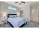 Inviting bedroom with plush bed, modern decor, closet and a window, perfect for relaxation at 513 Founders Creek Ave, North Las Vegas, NV 89084