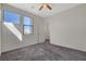 Bright, airy bedroom with large windows and neutral decor, offering a versatile space at 513 Founders Creek Ave, North Las Vegas, NV 89084
