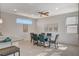 Bright dining area featuring a modern light fixture, stylish furniture, and ample natural light at 513 Founders Creek Ave, North Las Vegas, NV 89084