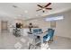 Open-concept dining room with modern table and chairs, conveniently located near the kitchen and stairs at 513 Founders Creek Ave, North Las Vegas, NV 89084
