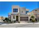 Contemporary home featuring modern design, desert landscaping, and a welcoming entrance at 513 Founders Creek Ave, North Las Vegas, NV 89084