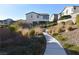 Picturesque walkway and green space with inviting bench seating, perfect for enjoying a peaceful outdoor experience at 513 Founders Creek Ave, North Las Vegas, NV 89084
