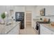 Bright kitchen features granite counters, stainless appliances and walk-in pantry at 513 Founders Creek Ave, North Las Vegas, NV 89084