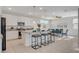 Modern kitchen open to dining room with stainless steel appliances and a large island with breakfast bar at 513 Founders Creek Ave, North Las Vegas, NV 89084