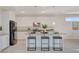 Modern kitchen with granite countertops, stainless steel appliances, and a breakfast bar with seating at 513 Founders Creek Ave, North Las Vegas, NV 89084