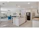 Open kitchen featuring granite countertops, stainless steel appliances, and a breakfast bar island at 513 Founders Creek Ave, North Las Vegas, NV 89084