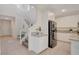 Contemporary kitchen featuring granite counters, stainless appliances, and tile floors at 513 Founders Creek Ave, North Las Vegas, NV 89084