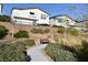 Beautifully landscaped green area with bench seating, creating a serene environment amidst modern homes at 513 Founders Creek Ave, North Las Vegas, NV 89084