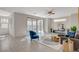 Bright living room featuring neutral walls, tile flooring, a modern sofa and an abundance of natural light at 513 Founders Creek Ave, North Las Vegas, NV 89084