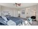 Well-lit main bedroom featuring a queen-sized bed, modern decor, and an ensuite bathroom at 513 Founders Creek Ave, North Las Vegas, NV 89084