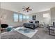 Spacious main bedroom with large windows, desk and cozy seating area, filled with natural light at 513 Founders Creek Ave, North Las Vegas, NV 89084