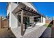 Cozy outdoor patio with modern furniture, pergola and hardscape at 513 Founders Creek Ave, North Las Vegas, NV 89084