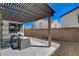 Cozy outdoor patio with modern furniture, pergola and hardscape at 513 Founders Creek Ave, North Las Vegas, NV 89084