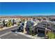 A residential neighborhood with modern homes, manicured landscaping, and tree-lined streets under a clear blue sky at 513 Founders Creek Ave, North Las Vegas, NV 89084