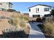 Scenic walking path with lush landscaping and comfortable seating creating an inviting outdoor space at 513 Founders Creek Ave, North Las Vegas, NV 89084