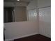 Cozy living room featuring hardwood floors, a large mirror, and a closet at 5130 S Jones Blvd # 108, Las Vegas, NV 89118