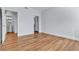 Bedroom features hardwood floors, multiple doorways, and light blue walls at 5162 S Jones Blvd # 106, Las Vegas, NV 89118