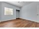 This bedroom features hardwood floors, a window for natural light, and a walk in closet at 5162 S Jones Blvd # 106, Las Vegas, NV 89118