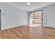 Bedroom featuring wood floors, neutral walls, and a sliding glass door leading to outdoor space at 5162 S Jones Blvd # 106, Las Vegas, NV 89118