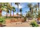 Community entrance sign reading 'Alexis Heights Condominiums' surrounded by lush, mature landscaping at 5162 S Jones Blvd # 106, Las Vegas, NV 89118