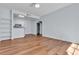 An open-concept living room featuring hardwood flooring, recessed lighting, and an open kitchen at 5162 S Jones Blvd # 106, Las Vegas, NV 89118