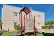 Community playground surrounded by synthetic turf and mature landscaping at 5162 S Jones Blvd # 106, Las Vegas, NV 89118