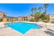 Enjoy this sparkling community pool surrounded by palm trees and ample space for relaxation at 5162 S Jones Blvd # 106, Las Vegas, NV 89118