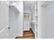 A well-organized walk-in closet featuring white shelving and hardwood floors at 5162 S Jones Blvd # 106, Las Vegas, NV 89118