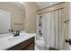 Bathroom featuring a shower-tub combo and a single sink vanity at 6021 Vista Clara St, Las Vegas, NV 89148