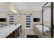 Bathroom featuring a soaking tub, double vanity, and a sliding barn door to the toilet at 6021 Vista Clara St, Las Vegas, NV 89148