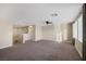 Spacious bonus room with carpeting, natural light, and a ceiling fan at 6021 Vista Clara St, Las Vegas, NV 89148