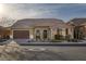 Attractive single-Gathering home with a tile roof, well-manicured landscaping, and a paved driveway at 6021 Vista Clara St, Las Vegas, NV 89148