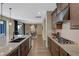 Well-appointed kitchen with a central island, granite countertops, stainless steel appliances, and ample cabinet space at 6021 Vista Clara St, Las Vegas, NV 89148