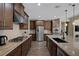 Modern kitchen with stainless steel appliances, ample cabinets, and a large center island with bar seating at 6021 Vista Clara St, Las Vegas, NV 89148