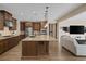 Modern kitchen with stainless steel appliances, a large island, and sleek countertops perfect for entertaining at 6021 Vista Clara St, Las Vegas, NV 89148