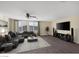 Upstairs living room featuring modern furnishings, a TV, and ample seating at 6021 Vista Clara St, Las Vegas, NV 89148