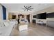 Spacious living room with wood flooring, neutral colors, and an open layout to the kitchen, great for entertaining at 6021 Vista Clara St, Las Vegas, NV 89148