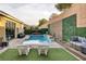 Inviting pool area features comfortable lounge chairs and cozy outdoor seating areas at 6021 Vista Clara St, Las Vegas, NV 89148