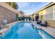 Backyard pool and seating area features modern landscaping, ample seating and lounging options at 6021 Vista Clara St, Las Vegas, NV 89148