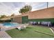 Sparkling pool surrounded by lush landscaping and ample lounge seating for ultimate relaxation at 6021 Vista Clara St, Las Vegas, NV 89148