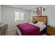 Bedroom with natural light, carpet flooring, and custom decor at 6208 Rathbone St, Las Vegas, NV 89166