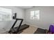 Exercise room with carpet and two windows for natural light at 6208 Rathbone St, Las Vegas, NV 89166