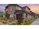 Charming multi-story home with well-manicured front yard and welcoming entrance at 6208 Rathbone St, Las Vegas, NV 89166